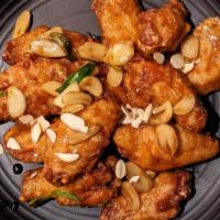 Garlic Fried Chicken Wings 갈릭치킨 · Fried chicken wings smothered in a glaze of soy-based sauce and topped with sliced garlic to...