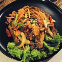 Japchae  잡채 · Glass noodles with stir fried carrots, onions, red peppers, green onions and marinated beef