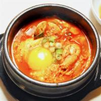 Soft Tofu Soup  순두부 · Spicy tofu soup made with freshly curdled soft tofu, mushrooms, onion, and red chili paste s...