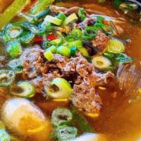 Doen-Jang Jjigae  된장찌개 · Rich stew made with soybean paste, scallions, zucchini, radishes, chili peppers, mushrooms, ...