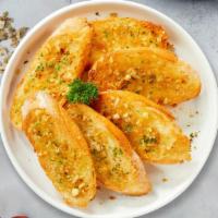 Garlic Bread · Fresh organic garlic bread seasoned with garlic, butter and spices. Served with our home mad...