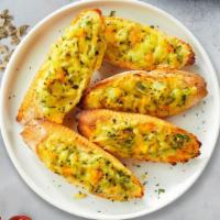 Cheese Bread · Organic garlic bread topped with Mozzarella and Parmesan cheese. Served with our home made M...