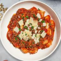 Meaty Gnocchi · Gnocchi topped with home made meat sauce, Parmesan, and fresh Italian Parsley