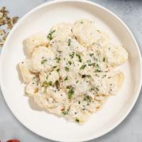 Tortellini With Alfredo · Tri-color cheese tortellini in a creamy garlic sauce, with Parmesan and fresh Italian parsley