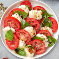 Caprese · Fresh mozzarella cheese, tomatoes, fresh basil, and homemade Italian dressing.