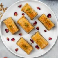 Baklava · Sweet layers of filo pastry filled with chopped nuts and honey.