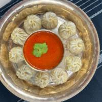 Steamed Momo (10 Pieces) · Minced protein seasoned with fresh herbs and serve with dipping sauce.