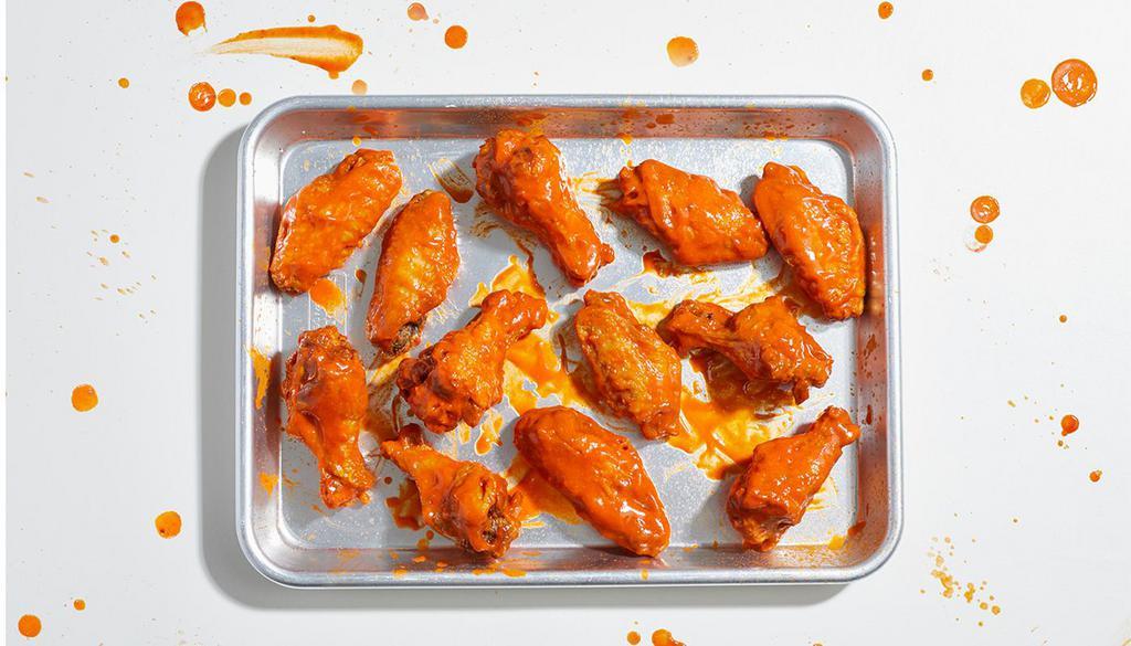 Bone-In Chicken Wings (12) · 12 bone-in chicken wings with your choice of sauce. Served with celery or carrots, and blue cheese or ranch.