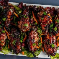 Jerk Wings · Chicken wings grilled in our homemade jerk seasoning, topped with our sweet fire jerk sauce....