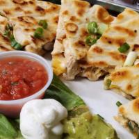 Pitadilla  · Quesadilla made with Pita Bread cheese onions, peppers taco meat