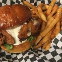 Fried Chicken Burger · 6 oz. chicken breast with bacon swiss cheese and lettuce tomato and sautéed red onion on a b...