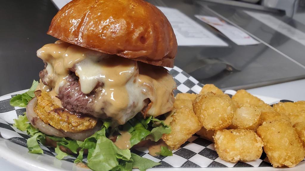 Peanut Butter Bacon Cheese Burger · 1/3 lb. Bacon cheeseburger served peanut butter sauce and lettuce tomato and grilled red onion on a brioche bun