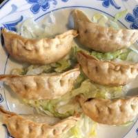 A105 Pan Fried Pot Stickers (6) · All handmade dumplings to savor your appetite. Pork and cabbage.