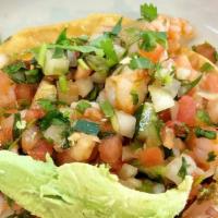 Ceviche Tostada · Prawns marinated in lime juice with pico de gallo and avocado sliced on top of a homemade co...