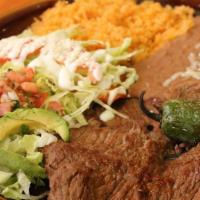 Carne Asada · Tender shirt steak charbroiled served with rice, beans, fried jalapeño, pico de gallo, avoca...