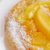 Peach Danish Roll · This flaky pastry is lightly sweetened with a pastry cream filling and peaches