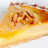 Pear Almond Tartlet · Syrup soaked pear halves lie on top of a layer of almond creme, all on a buttery dough shell...
