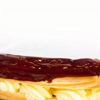 Eclair · Fresh Pate a Choux filled with a vanilla pastry creme, topped off with dark chocolate fondan...