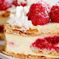 Raspberry Napoleon · Layers of flaky pastry dough are alternated between a rich vanilla pastry creme, with fresh ...