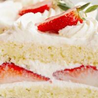 Strawberry Cake · Two layers of moist white genoise soaked in Kirsch, divided by layers of fresh strawberries ...