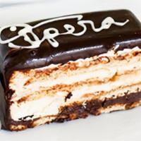 Opera · Alternating layers of mocha butter creme and chocolate ganache lies on top of an almond bisc...