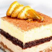 Le Croqueline (Orange Mousse) · Grand Marnier and praline mousse divided by layers of chocolate and almond biscuits as well ...