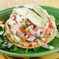 Aguachiles · Shrimp in fresh lime juice with serrano peppers, cucumbers, red onion.