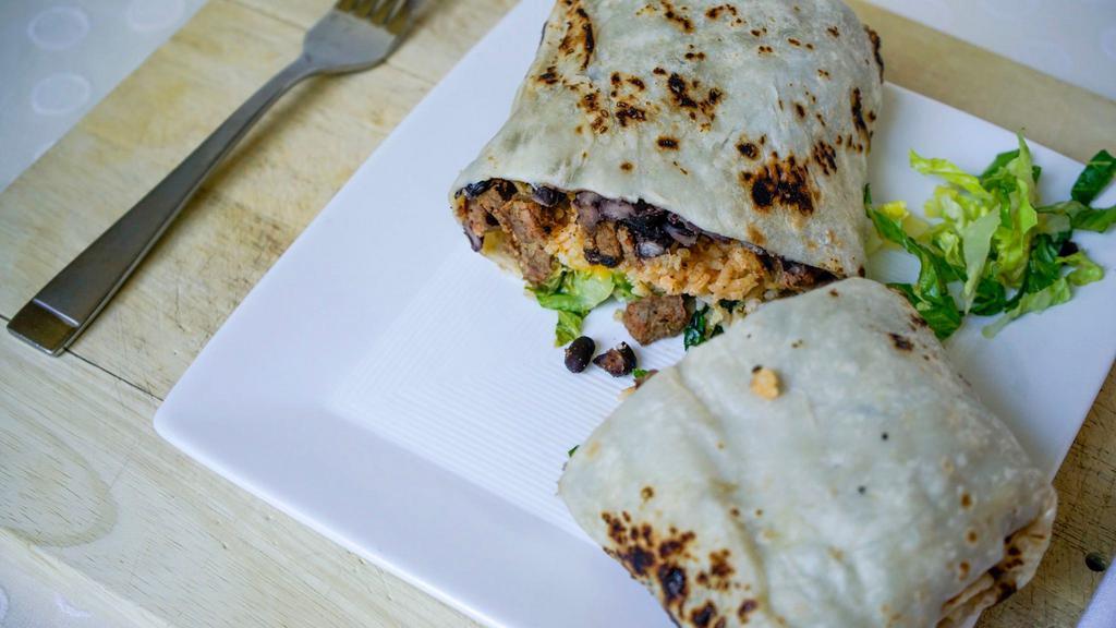 Burrito · Black beans, sour cream, shredded cheese, and lettuce and sauce, wrapped in a flour tortilla.