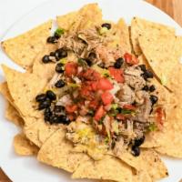 Pica Pica Chips · Crispy corn chips, your choice of Meat, comes with black beans, salsa, sour cream, shredded ...