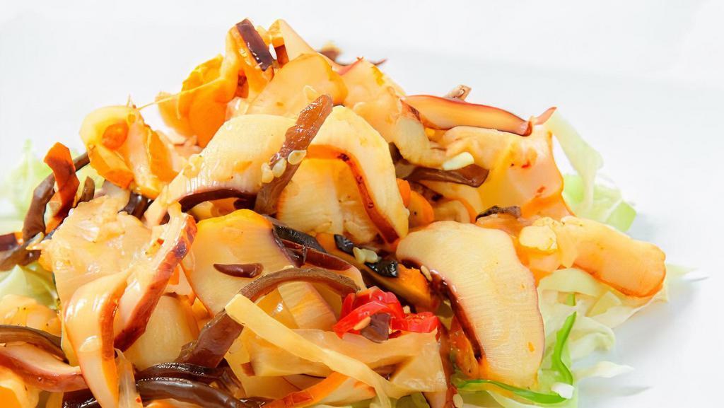 Squid Salad · Diced squid, seasoned and topped with sesame seeds.