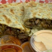 Big Quesadilla · Pork pastor and beef, bacon, and chipotle dressing with guacamole on the side.