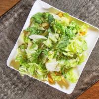 Caesar Salad · Crispy romaine lettuce and shaved parmesan cheese, and herbed croutons.
