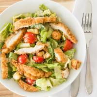 Chicken Caesar Salad · Tender pieces of grilled chicken on top of caesar salad.