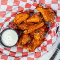 Wings · Tossed in: Buffalo / Hot Buffalo / BBQ / Hot BBQ /
Sweet Chili / Garlic Parm / Mango Habaner...