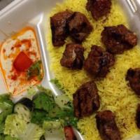 Beef Kabob · Charbroiled cubes of tender beef. Marinated with onions and special spices. Served with humm...