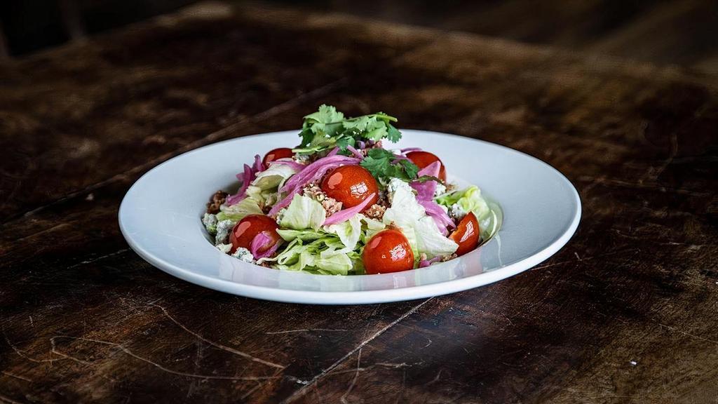 The Wedge · Cubed iceberg lettuce, pickled red onion, applewood smoked bacon, heriloom cherry tomatoes, blue cheese dressing