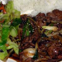 Mongolian Beef · Thin beef sautéed green onions and yellow onions mixed with mild sauce.