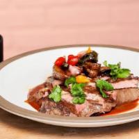 Carne Asada · Strip loin, crispy fingerlings, black beans, perdida steak sauce
