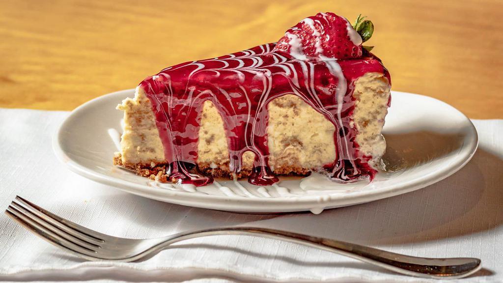 Brulee Cheesecake · A home-made, rich and creamy baked cheesecake, glazed in a luscious cream and raspberry sauce.