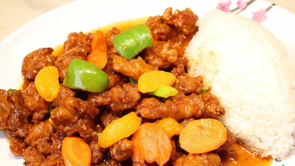 Orange Chicken · Roasted chicken, orange glaze with rice, seasonal vegetables.