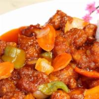 Sweet & Sour Chicken · Deep-fried chicken sautéed in sweet & sour sauce with onions, green peppers & carrots.