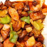 Kung Pao Chicken · Stir-fried chicken with onions, carrots, green peppers and peanuts.