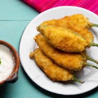 Jalapeño  Peppers · Delicious poppers filled with cream cheese and jalapeños, battered and fried to perfection.
