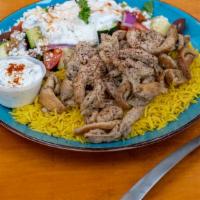 Chicken Shawarma Plate · Grilled chicken shawarma drizzled with our homemade tzatziki sauce served with a bed of basm...