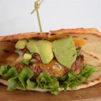 Vegan Southwest Burger · Beyond patty topped with vegan cheddar, avocado, pico de gallo, and chopped romaine on vegan...