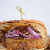 Vegan Onion & Mushroom Burger · Beyond patty topped with vegan cheddar, red onions, mushrooms and A1 steak sauce on vegan fl...