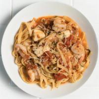 Spicy Shrimp Fettuccini · Lightly spicy tomato-butter sauce, fresh mozzarella, parmesan