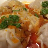 Spicy Chicken Dumpling · Steam chicken dumpling  Served with dumpling sauce and chili oil