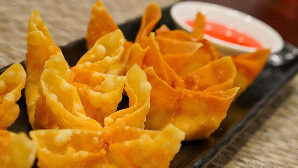 Crab Wonton · 6 deep fried wontons with real crab and cream cheese stuffing.