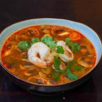 Tom Yum Soup · Spicy lemongrass soup mixed with mushroom and your choice of chicken or shrimp.